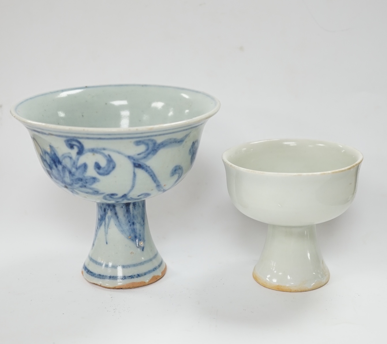 Two Chinese stem cups including a blue and white example, 10.5cm. Condition - fair to good